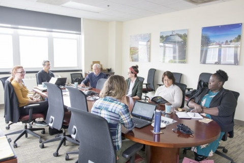 iCAP Working Group meeting showing committee members at the table